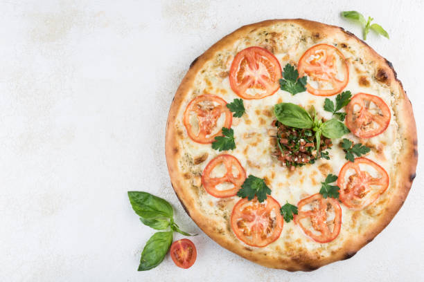 istock Pizza with chicken and garlic, Caesar sauce, pork, tomatoes and Mozzarella cheese 1327488152