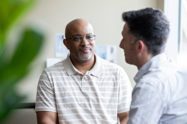istock Mature man listens to therapist during counseling session 1327492590