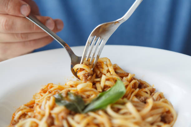 istock How to eat pasta with cutlery 1327492707
