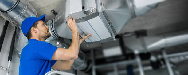 ventilation system installation and repair service. hvac technician at work. banner copy space - technicus stockfoto's en -beelden