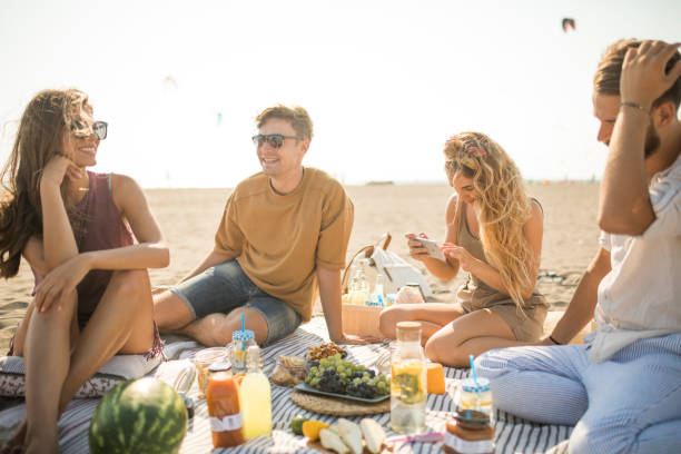 istock Pleasant beach picnic with my friends 1327494077