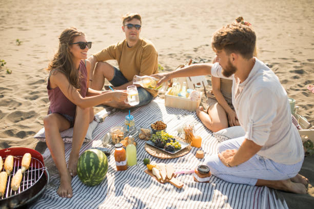 istock Pleasant beach picnic with my friends 1327494207