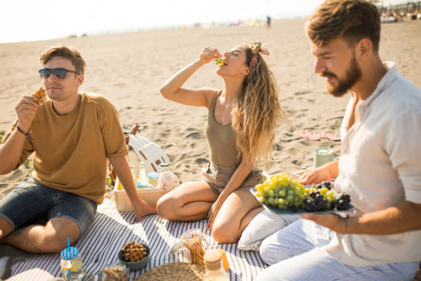 istock Pleasant beach picnic with my friends 1327494296