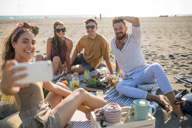 istock Pleasant beach picnic with my friends 1327494880