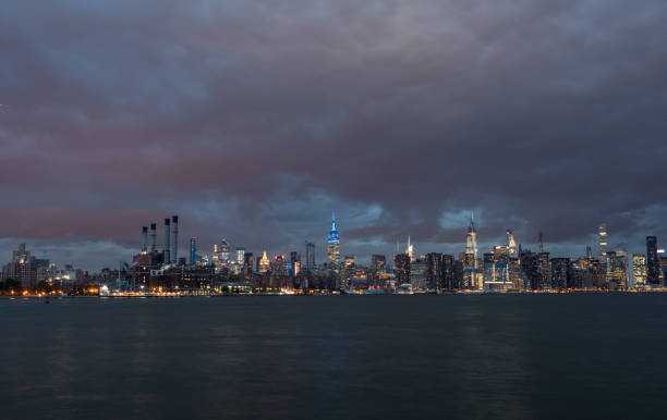 NYC Cityscape with Stormy Cloudy Blue Sky in Background