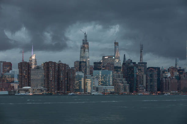istock NYC Cityscape with Stormy Cloudy Blue Sky in Background 1327495040