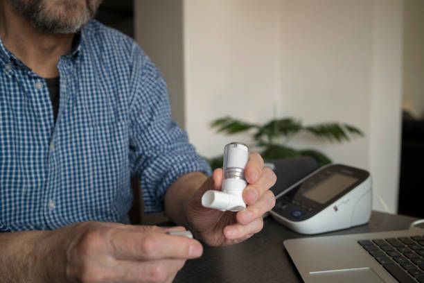 istock Senior man about to use asthma inhaler 1327495123