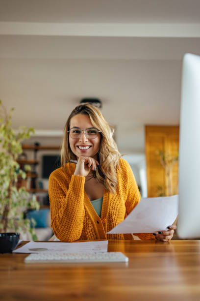 istock Adult woman, striking a pose, while trying to work. 1327495186