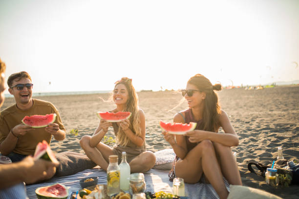 istock Pleasant beach picnic with my friends 1327495286