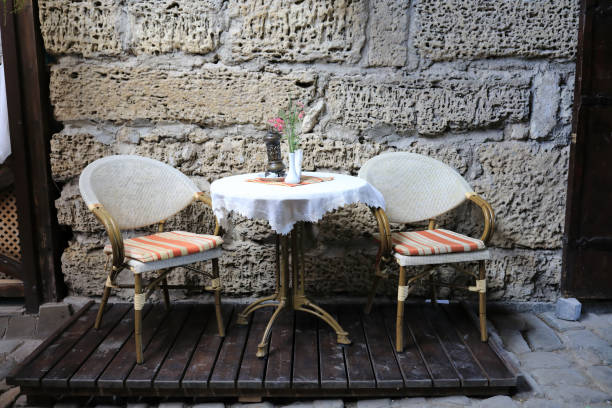 istock Table and two chairs of cafe on street 1327495517