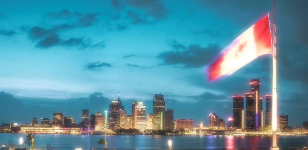Detroit, Michigan - Skyline at Dusk (Canadian Flag from Windsor in Foreground)