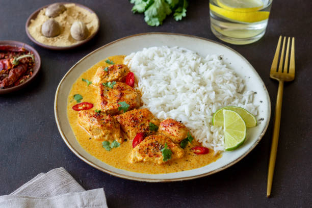 Chicken tikka masala curry with rice, herbs and peppers. Indian food. National cuisine. Chicken tikka masala curry with rice, herbs and peppers. Indian food. National cuisine masala stock pictures, royalty-free photos & images