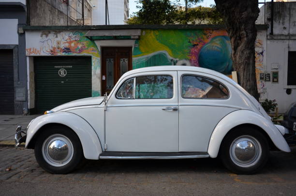 old white volkswagen beetle in buenos aires - beetle imagens e fotografias de stock