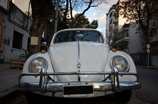 Old white Volkswagen Beetle, most likely made in Germany, still in use in Buenos Aires