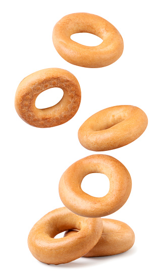 Drying bagels fly close-up on a white background, levitating. Isolated