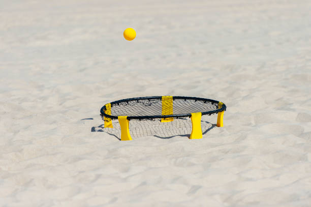 istock Spike ball game with yellow ball on sand. Summer game concept 1327515002