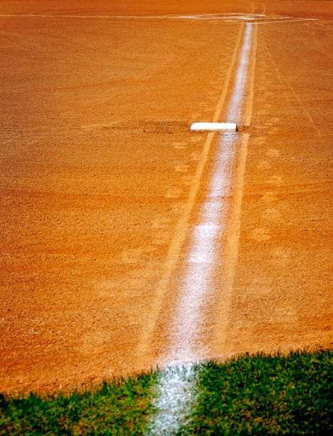 istock Baseball base and chalked base line in diamond 1327516410