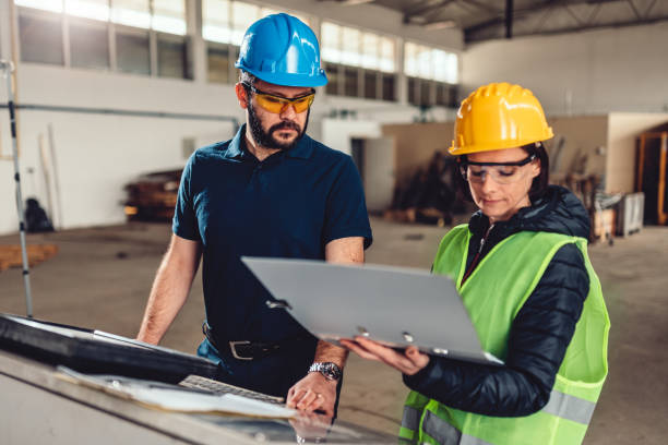 istock Workplace safety inspector at industrial factory 1327517543