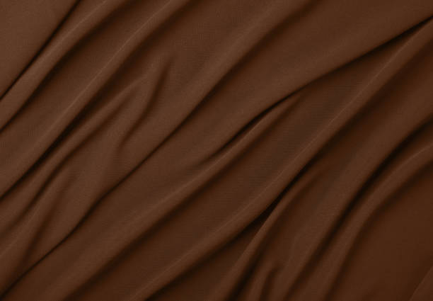 Closeup detail of brown fabric texture background.