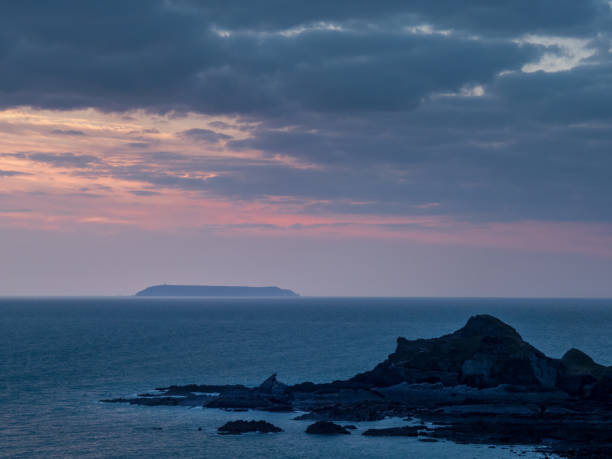 istock Sunset view of Lundy island from Hartland beach. Devon, UK. 1327522249