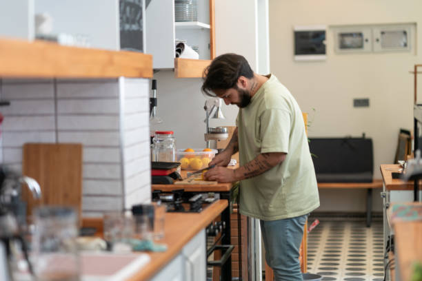 istock Coffee shop owner working behind the counter 1327526574