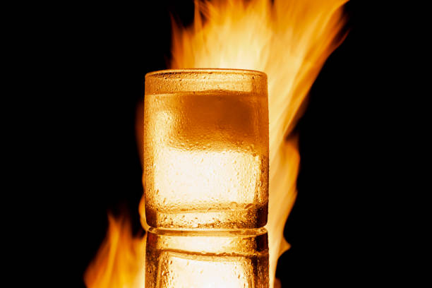 istock glass of ice on fire on a black background 1327527213