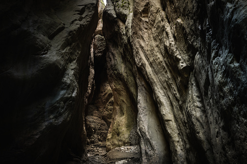 Aerial View Of A Businessman Standing On Top Of A Stunning Natural Bridge Formation