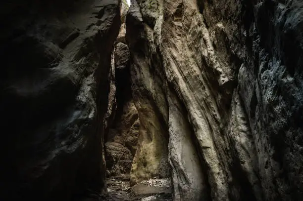 Photo of A narrow canyon of a mountain gorge, illuminated by the sun in Dagestan. The Karabakh gorge, the gateway to a fairy tale.