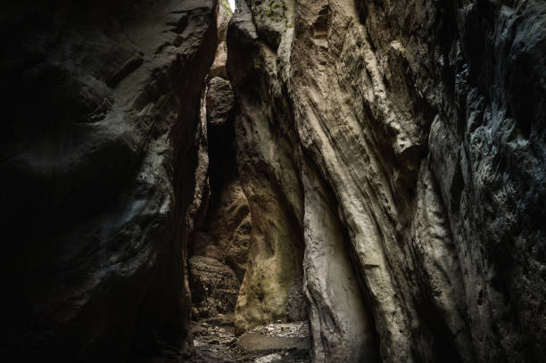 a narrow canyon of a mountain gorge, illuminated by the sun in dagestan. the karabakh gorge, the gateway to a fairy tale. - crevice imagens e fotografias de stock