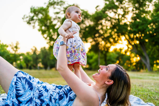 istock Mother playing with her daughter outdoor 1327532601