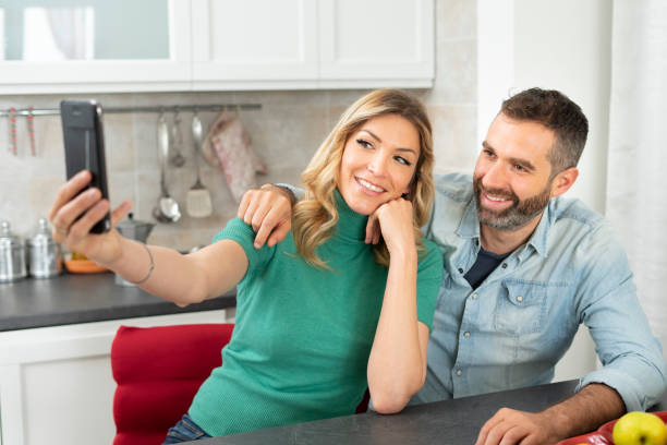 istock Happy couple takes a selfie in the kitchen. 1327533754