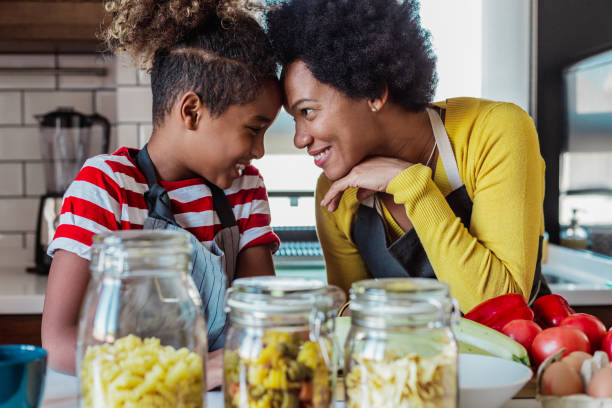 istock Tender moments between a caring mother and her daughter in the kitchen 1327533894