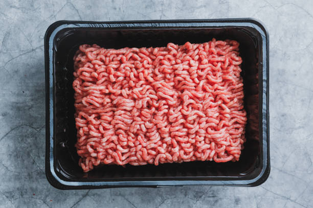 istock Minced meat with spices in box on table 1327536068
