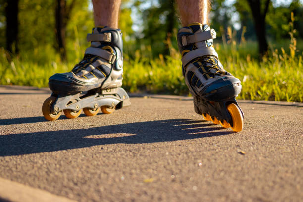 istock Roller skates on men's legs. At sunset 1327536968