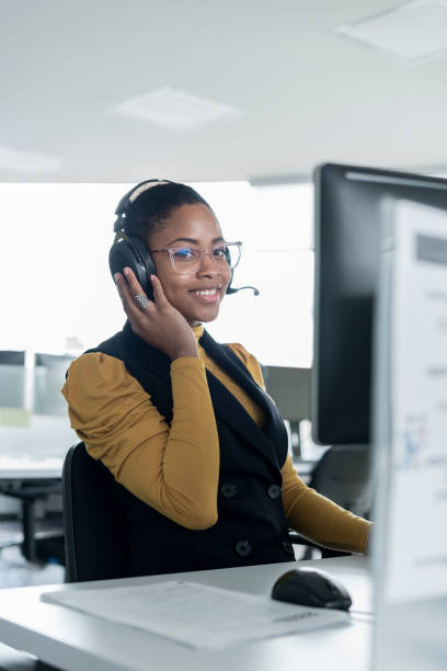 istock Afro woman dressed formally is in front of her computer working 1327537055