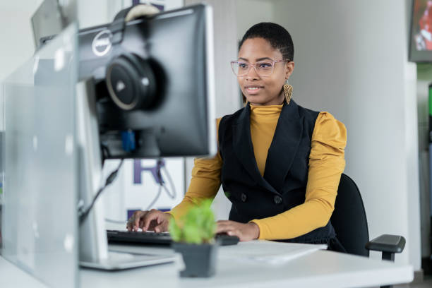 istock Afro woman dressed formally is in front of her computer working 1327537096