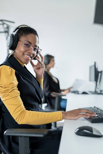 istock Afro woman dressed formally is in front of her computer working 1327537764