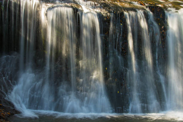 istock Autumn leaves of the waterfall 1327539761