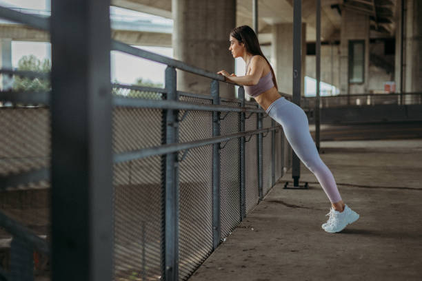 istock Young woman exercising 1327539875