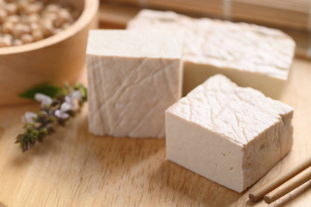 istock Fresh Tofu on wooden cutting board 1327543105