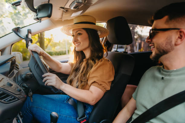 istock happy friends traveling by car 1327546108