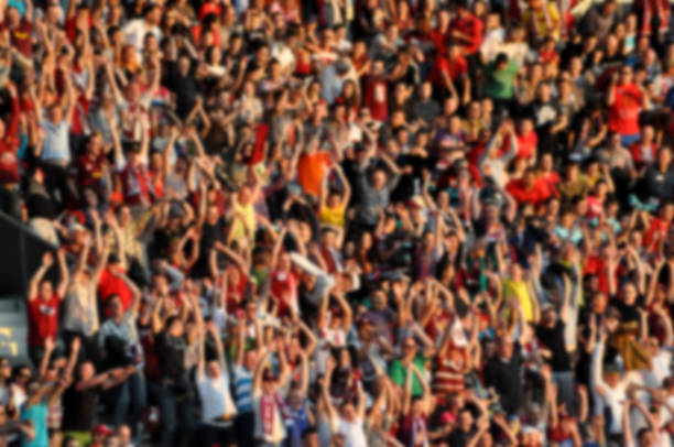 istock Blurred crowd of spectators in a stadium 1327548586