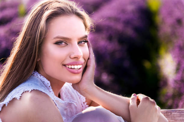 istock A young attractive woman poses in a lavender field 1327550145