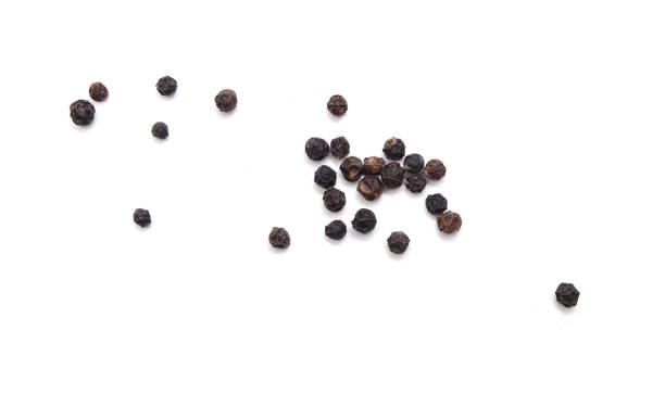 istock black peppercorns, isolated on white background 1327551428