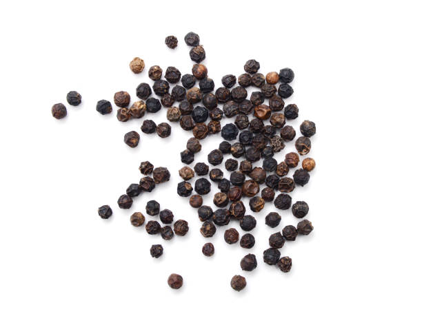 istock black peppercorns, isolated on white background 1327552037