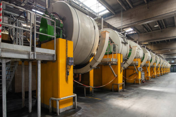 istock Tannery. Large metal barrels for leather dyeing 1327552104