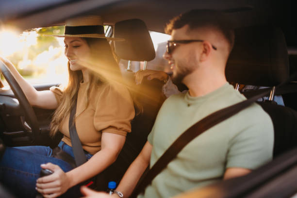 istock happy friends traveling by car 1327553654