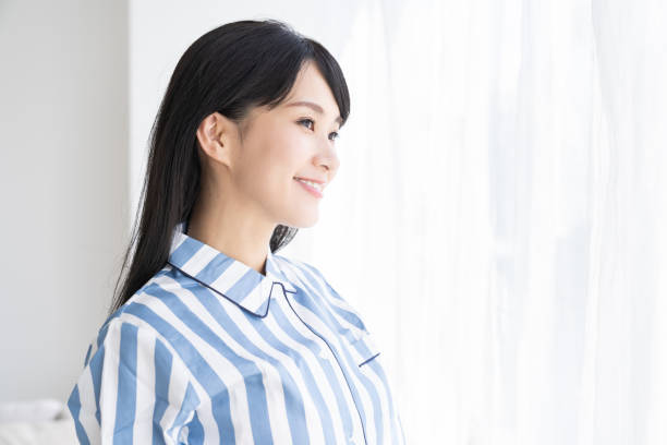istock asian woman in night clothes 1327554346