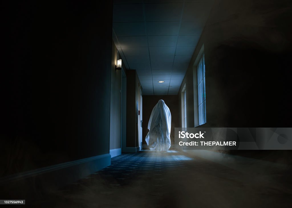 Spooky ghost moving alongside a hotel corridor Ghost Stock Photo