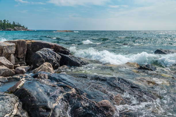 istock Surf at rocky promontory 1327557693